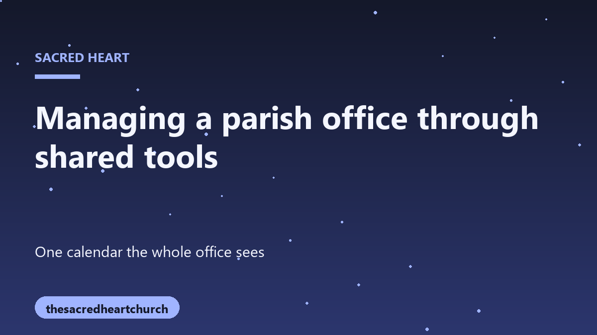 A neat desk in a church office with a computer and a stack of parish bulletins
